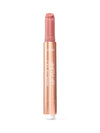 A slim rose-gold Tarte lip balm stick stands vertically, cap removed to reveal a rosy balm tip against a plain white background. Text: tarte MARACUJA JUICY LIP PLUMP
